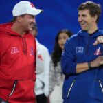 Peyton Manning (left) and Eli Manning react during the Pro Bowl Skills competition at the Intermountain Healthcare Performance Facility.