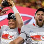 Jan. 29, 2023: Patrick Mahomes raises the Lamar Hunt Trophy while Travis Kelce celebrates after the Kansas City Chiefs' 23-20 win over the Cincinnati Bengals in the AFC championship game at Arrowhead Stadium.