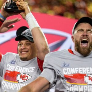 Jan. 29, 2023: Patrick Mahomes raises the Lamar Hunt Trophy while Travis Kelce celebrates after the Kansas City Chiefs' 23-20 win over the Cincinnati Bengals in the AFC championship game at Arrowhead Stadium.