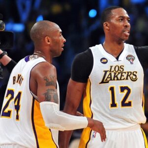 Los Angeles /Lakers center Dwight Howard (12) celebrates the 90-81 victory with shooting guard Kobe Bryant (24) against the Chicago Bulls at Staples Center.