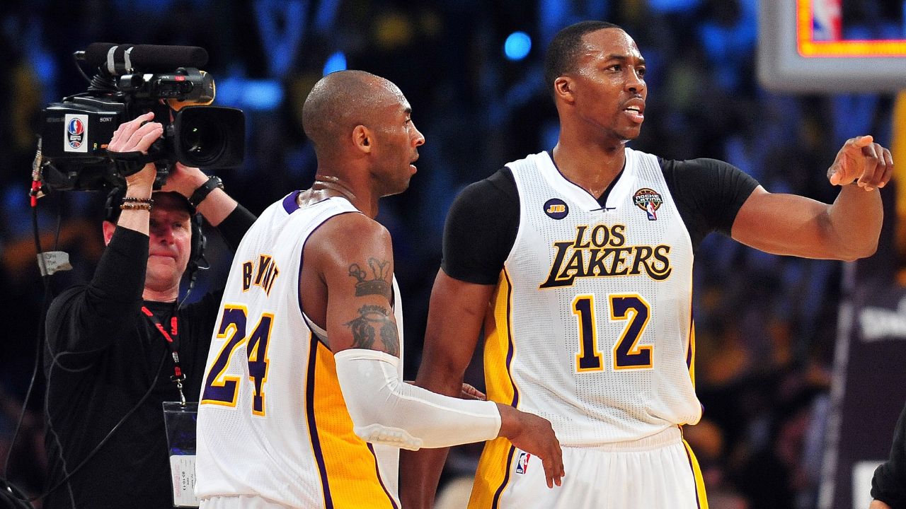 Los Angeles /Lakers center Dwight Howard (12) celebrates the 90-81 victory with shooting guard Kobe Bryant (24) against the Chicago Bulls at Staples Center.