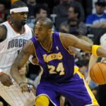 Los Angeles Lakers guard Kobe Bryant (24) drives against Charlotte Bobcats guard forward Stephen Jackson (1) during the game at Time Warner Cable Arena.