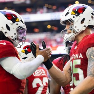 Arizona Cardinals quarterback Kyler Murray (1) celebrates a touchdown with tight end Trey McBride (85) against the San Francisco 49ers at State Farm Stadium.