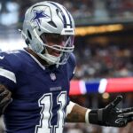 Dallas Cowboys linebacker Micah Parsons (11) celebrates after a sack during the first quarter against the Washington Commanders at AT&T Stadium.