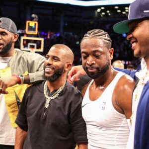 NBA stars LeBron James and Chris Paul and Carmelo Anthony pose with Miami Heat guard Dwayne Wade (3) after his last game against the Brooklyn Nets at Barclays Center.