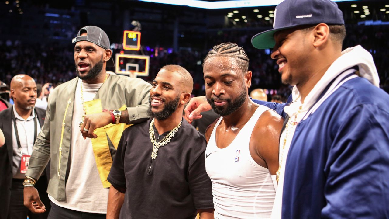NBA stars LeBron James and Chris Paul and Carmelo Anthony pose with Miami Heat guard Dwayne Wade (3) after his last game against the Brooklyn Nets at Barclays Center.