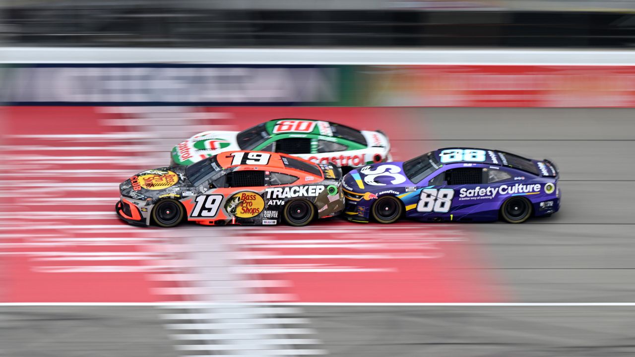 NASCAR Cup Series drivers Chase Briscoe (19) Ryan Preece (60) and Shane van Gisbergen (88) race bumper to bumper down the main straightaway during stage three of the FireKeepers Casino 400 at Michigan International Speedway.