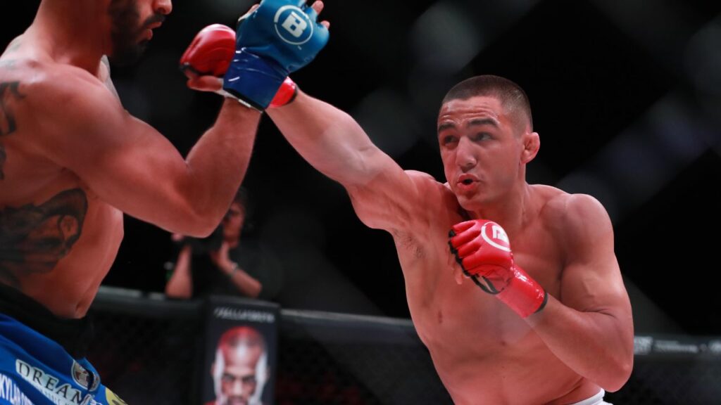Aaron Pico (red gloves) and Henry Corrales (blue gloves) during Bellator 214 at The Forum.