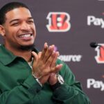 Cincinnati Bengals receiver Ja’marr Chase smiles as he takes questions during a press conference to announce the signing of new contracts for receivers Ja’Marr Chase and Tee Higgins at Paycor Stadium in downtown Cincinnati on Tuesday, March 18, 2025. Chase becomes the new highest-paid non-quarterback player in the NFL.