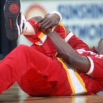 Apr 8, 1990; Orlando, FL, USA; FILE PHOTO; Houston Rockets center #34 HAKEEM OLAJUWON stretches before his game against the Orlando Magic at the Orlando Arena.