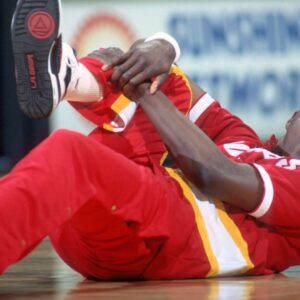 Apr 8, 1990; Orlando, FL, USA; FILE PHOTO; Houston Rockets center #34 HAKEEM OLAJUWON stretches before his game against the Orlando Magic at the Orlando Arena.