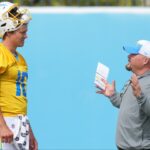 Los Angeles Chargers quarterback Justin Herbert (10) interacts with offensive coordinator Greg Roman during minicamp at the Hoag Performance Center.
