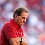 Coach Nick Saban watches his Crimson Tide players warm up before Alabama's 49-30 win over the Razorbacks in Fayetteville Saturday, October 8, 2016.