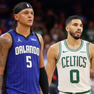 Apr 27, 2025; Orlando, Florida, USA; Orlando Magic forward Paolo Banchero (5) and Boston Celtics forward Jayson Tatum (0) wait fro a break in play in the fourth quarter during game four of first round for the 2025 NBA Playoffs at Kia Center. Mandatory Credit: Nathan Ray Seebeck-Imagn Images