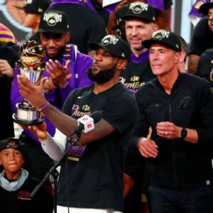 Los Angeles Lakers forward LeBron James (23) holds up the MVP trophy after game six of the 2020 NBA Finals at AdventHealth Arena. The Los Angeles Lakers won 106-93 to win the series.