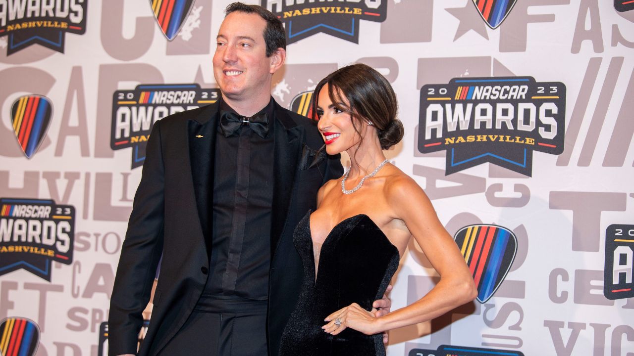 Kyle and Samantha Busch poses on the red carpet for the 2023 NASCAR Awards Banquet at the Music City Center in Nashville, Tenn.