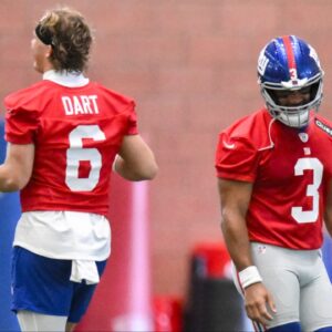 New York Giants quarterback Jaxson Dart (6) and quarterback Russell Wilson (3) interact during minicamp at Quest Diagnostics Training Center.