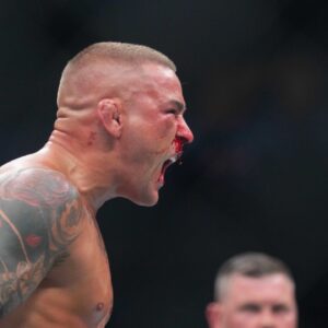 Dustin Poirier (blue gloves) reacts during the fight against Islam Makhachev (red gloves) during UFC 302 at Prudential Center.