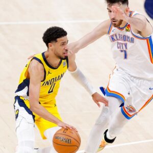 Indiana Pacers guard Tyrese Haliburton (0) drives to the basket past Oklahoma City Thunder forward Chet Holmgren (7) during the fourth quarter in game five of the 2025 NBA Finals at Paycom Center.