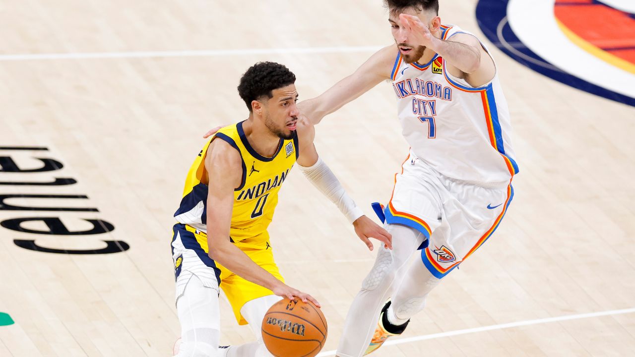 Indiana Pacers guard Tyrese Haliburton (0) drives to the basket past Oklahoma City Thunder forward Chet Holmgren (7) during the fourth quarter in game five of the 2025 NBA Finals at Paycom Center.
