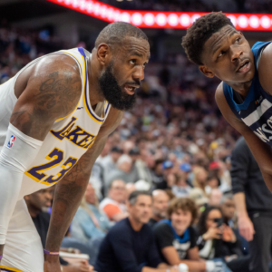 Minnesota Timberwolves guard Anthony Edwards (5) guards Los Angeles Lakers forward LeBron James (23)