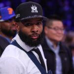 NFL wide receiver Odell Beckham Jr. sits courtside during the second half of the NBA game between the New York Knicks and the Phoenix Suns at Madison Square Garden.