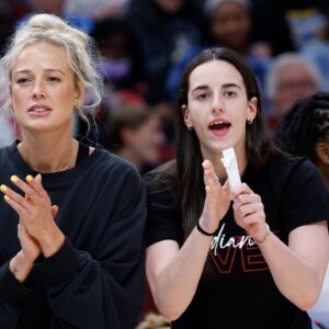 Jun 7, 2025; Chicago, Illinois, USA; Injured Indiana Fever guard Sophie Cunningham (8) and guard Caitlin Clark (22) react from the bench during the first half of a WNBA game against the Chicago Sky at United Center. Mandatory Credit: Kamil Krzaczynski-Imagn Images