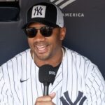 New York Giants quarterback Russell Wilson is interviewed prior to the game between the New York Mets and the New York Yankees at Yankee Stadium.