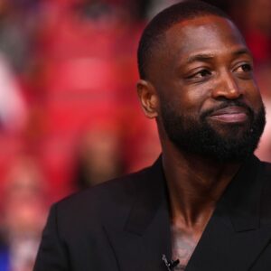 Jan 14, 2024; Miami, Florida, USA; Former Miami Heat player Dwayne Wade reacts after learning a statue will be erected outside of Kaseya Center in 2025, during a special ceremony during halftime of the game between the Miami Heat and the Charlotte Hornets