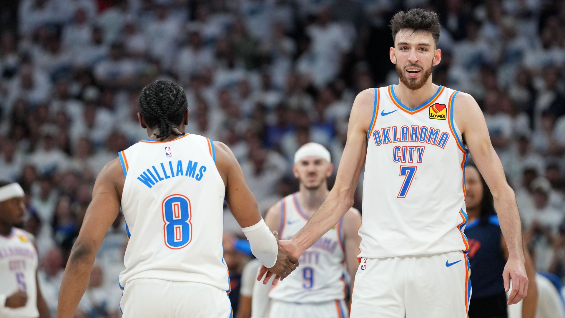 May 26, 2025; Minneapolis, Minnesota, USA;Oklahoma City Thunder forward Chet Holmgren (7) reacts with forward Jalen Williams (8) in the second half during game four of the western conference finals for the 2025 NBA Playoffs at Target Center.