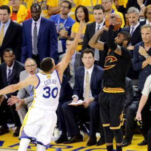 Cleveland Cavaliers guard Kyrie Irving (2) shoots the the game winning shot during the fourth quarter against Golden State Warriors guard Stephen Curry (30) in game seven of the NBA Finals at Oracle Arena.