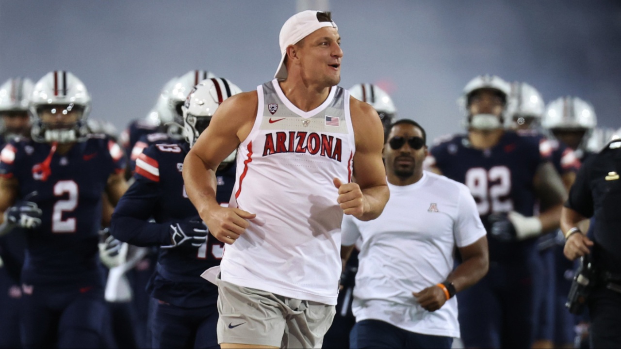 Rob Gronkowski leads the team onto the field as the honorary captain during the first half at Arizona Stadium.