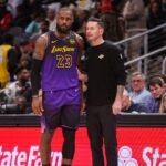 Dec 6, 2024; Atlanta, Georgia, USA; Los Angeles Lakers forward LeBron James (23) talks to head coach JJ Redick against the Atlanta Hawks in the second quarter at State Farm Arena. Mandatory Credit: Brett Davis-Imagn Images