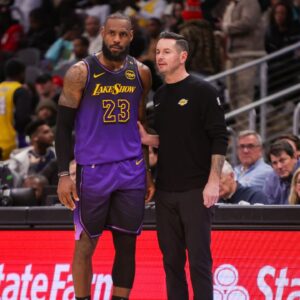 Dec 6, 2024; Atlanta, Georgia, USA; Los Angeles Lakers forward LeBron James (23) talks to head coach JJ Redick against the Atlanta Hawks in the second quarter at State Farm Arena. Mandatory Credit: Brett Davis-Imagn Images