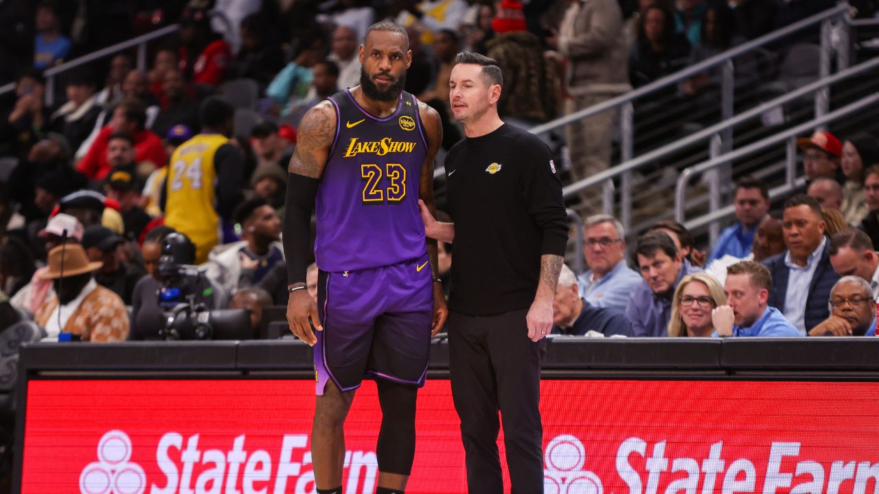 Dec 6, 2024; Atlanta, Georgia, USA; Los Angeles Lakers forward LeBron James (23) talks to head coach JJ Redick against the Atlanta Hawks in the second quarter at State Farm Arena. Mandatory Credit: Brett Davis-Imagn Images