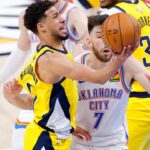 Jun 16, 2025; Oklahoma City, Oklahoma, USA; Indiana Pacers guard Tyrese Haliburton (0) drives to the basket past Oklahoma City Thunder forward Chet Holmgren (7) during the fourth quarter in game five of the 2025 NBA Finals at Paycom Center. Mandatory Credit: Alonzo Adams-Imagn Images