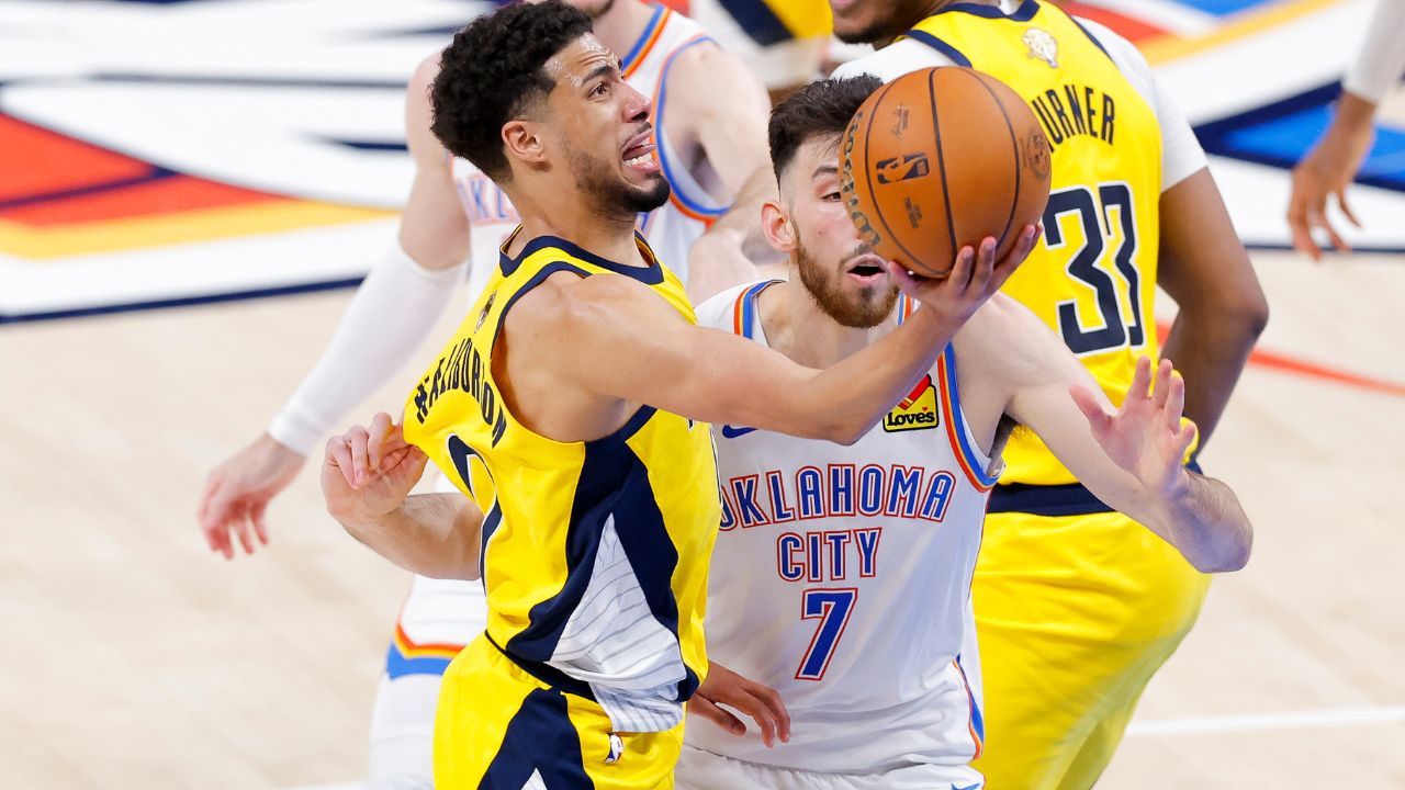 Jun 16, 2025; Oklahoma City, Oklahoma, USA; Indiana Pacers guard Tyrese Haliburton (0) drives to the basket past Oklahoma City Thunder forward Chet Holmgren (7) during the fourth quarter in game five of the 2025 NBA Finals at Paycom Center. Mandatory Credit: Alonzo Adams-Imagn Images