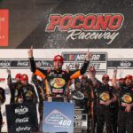 NASCAR Cup Series driver Chase Briscoe celebrates in victory lane after winning The Great American Getaway 400 at Pocono Raceway.