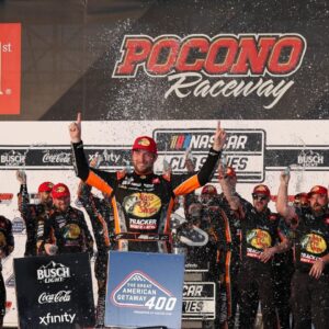 NASCAR Cup Series driver Chase Briscoe celebrates in victory lane after winning The Great American Getaway 400 at Pocono Raceway.