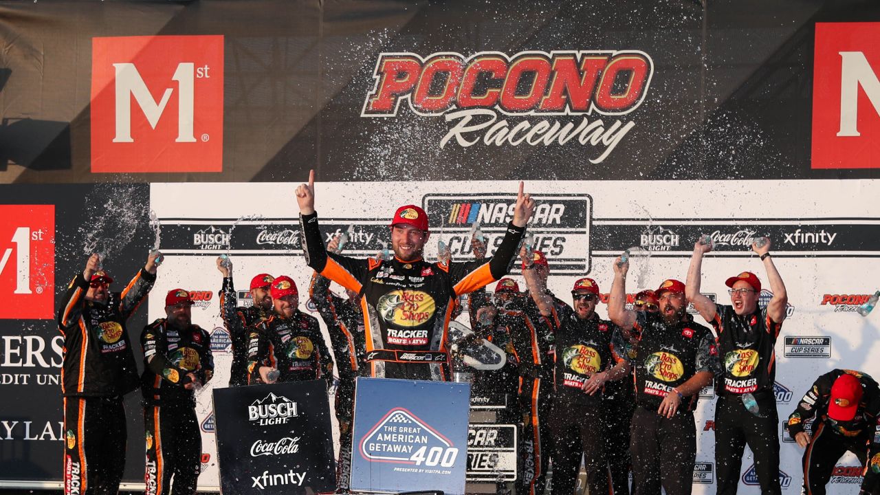 NASCAR Cup Series driver Chase Briscoe celebrates in victory lane after winning The Great American Getaway 400 at Pocono Raceway.