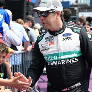 NASCAR Cup Series driver Brad Keselowski (6) greets the crowd during driver introductions before the start of the FireKeepers Casino 400 at Michigan International Speedway.