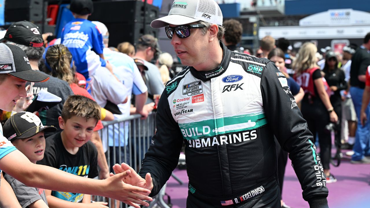 NASCAR Cup Series driver Brad Keselowski (6) greets the crowd during driver introductions before the start of the FireKeepers Casino 400 at Michigan International Speedway.