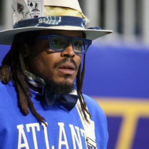 Former NFL quarterback Cam Newton watches a game between the Howard Bison and Florida A&M Rattlers in the first half at Mercedes-Benz Stadium.“They’re Playing Video Games All Day”: Cam Newton Blasts Gen Z Players Like Cam Skattebo for Not Recognizing NFL Legends