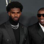 Deion Sanders (right) with his son Shedeur Sanders on the red carpet before Super Bowl LIX NFL Honors at Saenger Theatre.