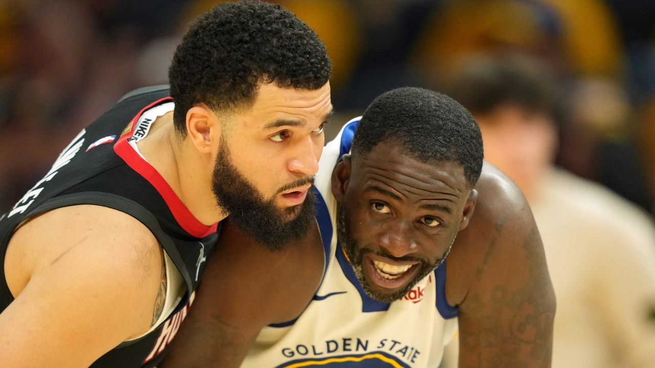 Houston Rockets guard Fred VanVleet (left) defends against Golden State Warriors forward Draymond Green (23) during the fourth quarter of game three of first round for the 2024 NBA Playoffs at Chase Center.