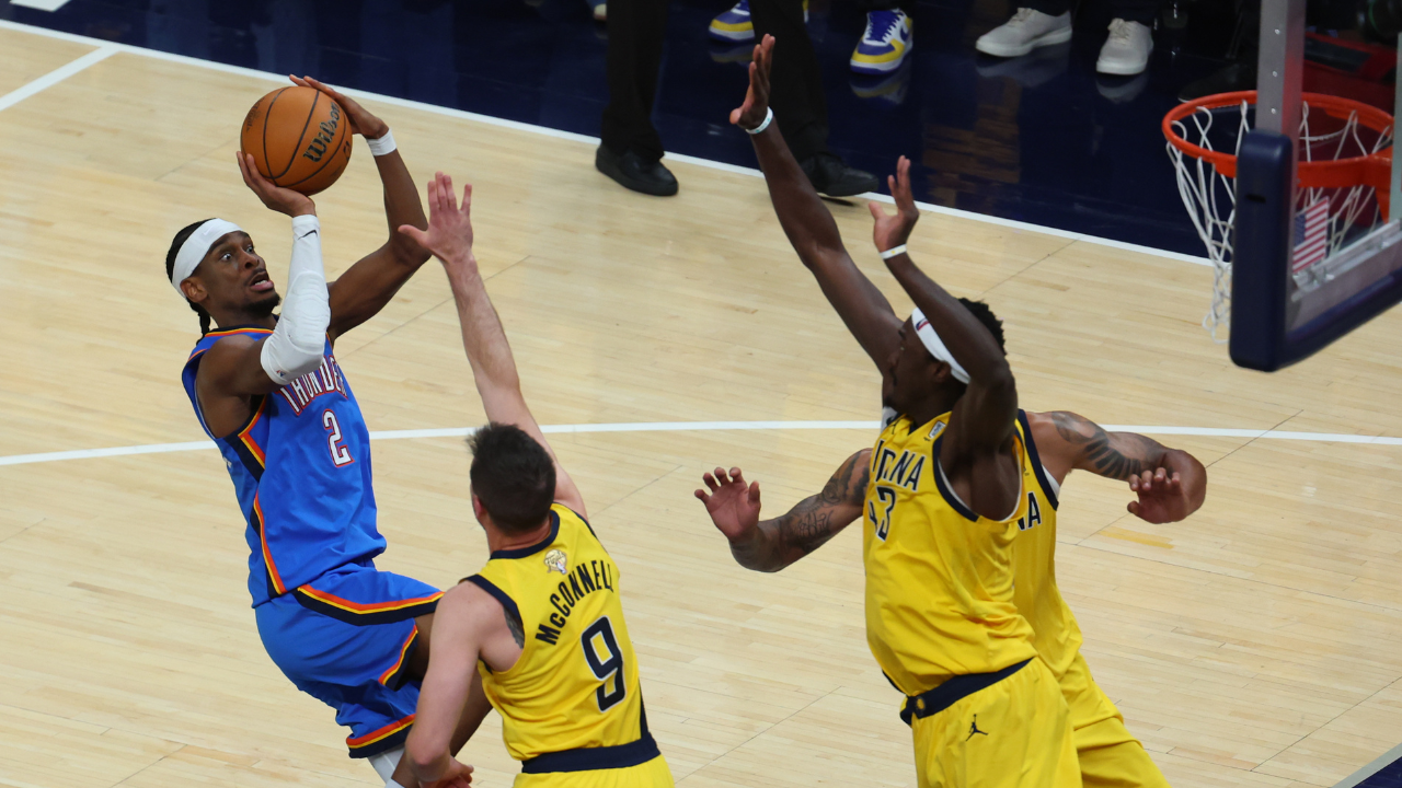 Oklahoma City Thunder guard Shai Gilgeous-Alexander (2) drives to the hoop past Indiana Pacers guard T.J. McConnell (9) during the third quarter of game four of the 2025 NBA Finals
