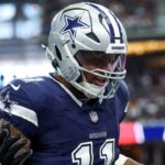 Dallas Cowboys linebacker Micah Parsons (11) celebrates after a sack during the first quarter against the Washington Commanders at AT&T Stadium.