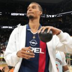 San Antonio Spurs center Victor Wembanyama (1) prepares to throw a ball in to the stands in celebration of Fan Appreciation Day after a victory over the Toronto Raptors at Frost Bank Center.