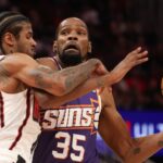 Phoenix Suns forward Kevin Durant (35) drives to the net against Houston Rockets guard Jalen Green (4) in the first quarter at Toyota Center.