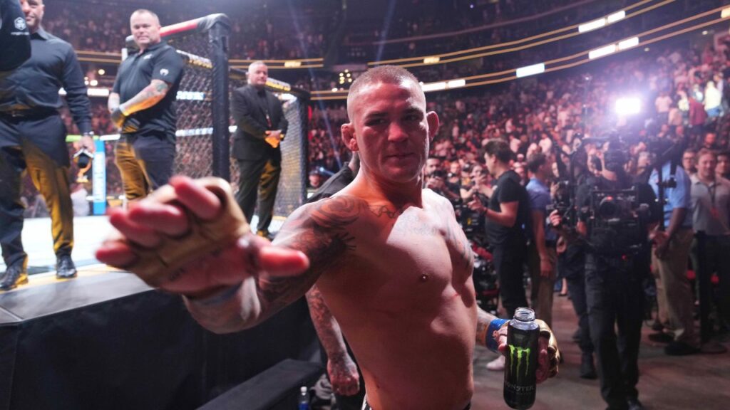 Dustin Poirier (blue gloves) after the fight against Islam Makhachev (red gloves) during UFC 302 at Prudential Center.